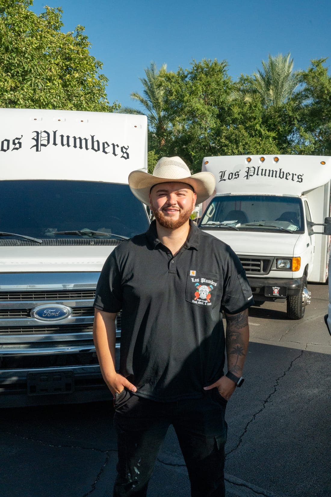 A Los Plumbers technician with the company fleet in Mesa, Arizona